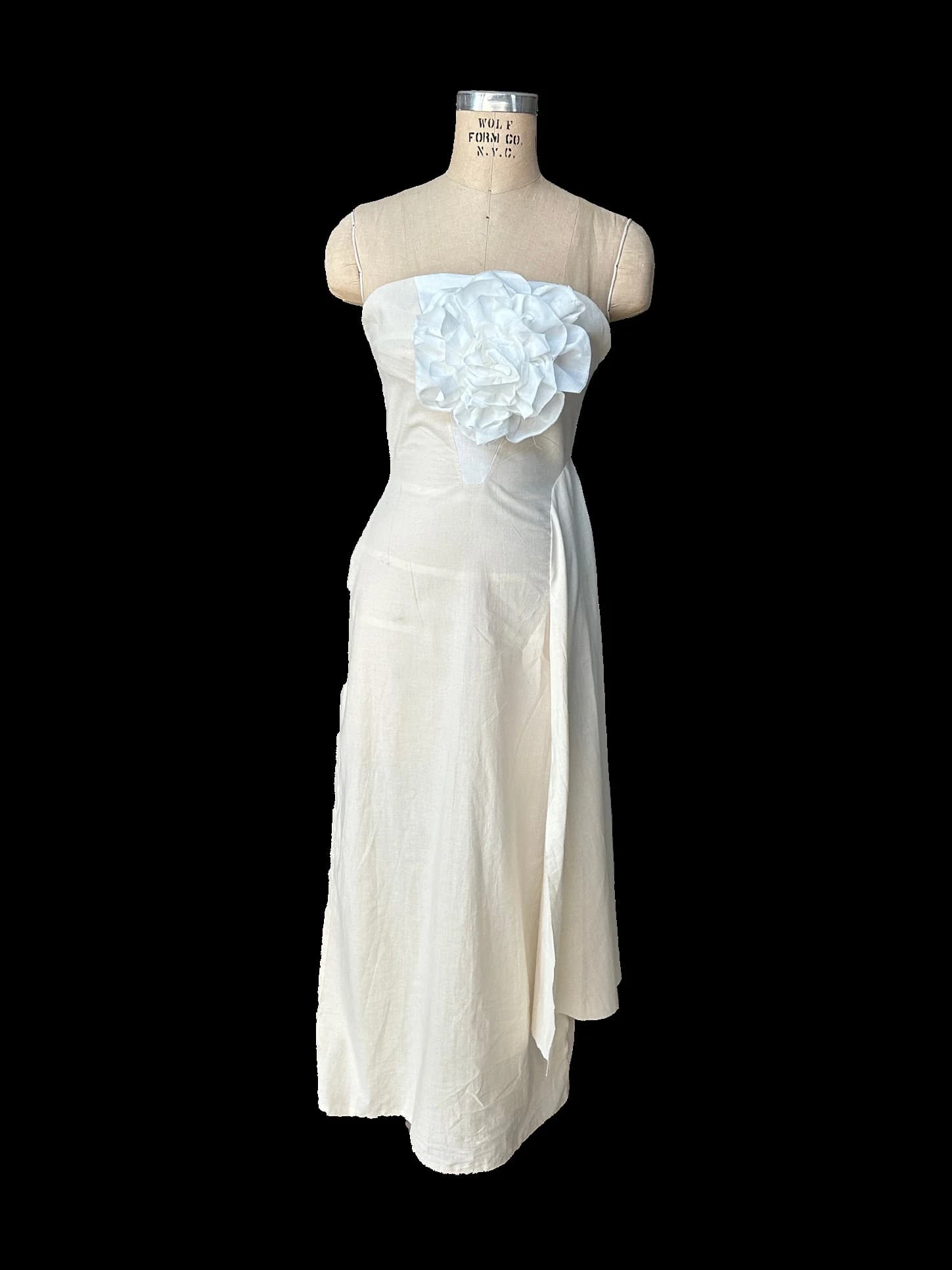 White Passion dress toile on a dress form, front view.